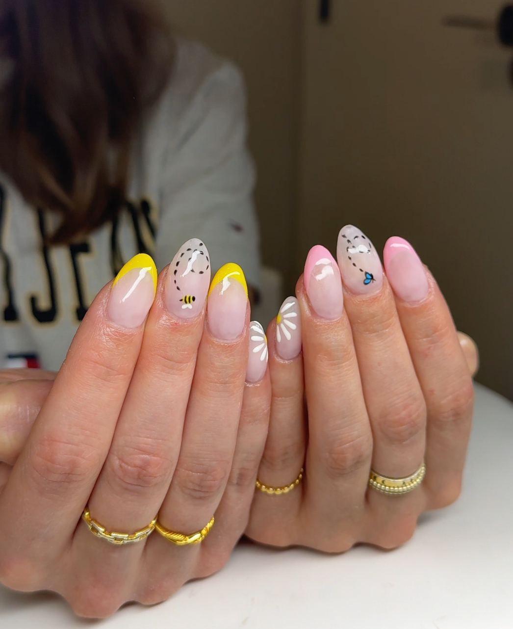 Yellow French tips with hand painted bee and daisy art